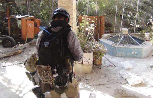 A U.N. chemical weapons expert gathers evidence at one of the sites of an alleged poison gas attack in the southwestern Damascus suburb of Mouadamiya August 26 2013.