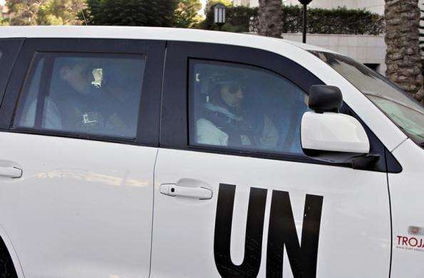 A U.N. vehicle carrying a team of United Nations chemical weapons experts is pictured as they return to their hotel in Damascus after visiting one of the sites of an alleged poison gas attack August 26 2013.