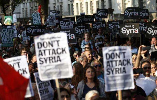 Protestors listen to speeches during a rally against the proposed attack on Syria in central London August 28 2013.