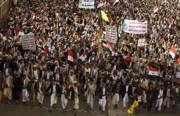 Protesters loyal to the Shia Muslim Al-Houthi group also known as Ansarullah march during a demonstration against potential strikes on the Syrian government in Sanaa Yemen August 30 2013.
