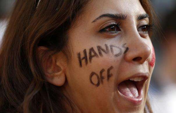 A protestor shouts slogans during a rally against the proposed attack on Syria in central London August 28 2013.