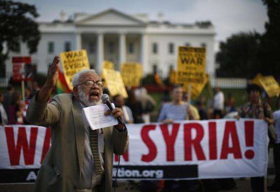 Protester Ashraf El-Bayoumi shouts against a military strike against Syria during the 