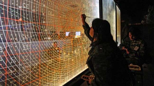 The Russian Defense Ministry says it has detected ballistic objects fired in the Mediterranean Sea. Above, a Russian officer is seen working on a radar screen.