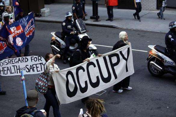 Occupy Wall Street protesters march along 47th Street in New York September 17 2013.