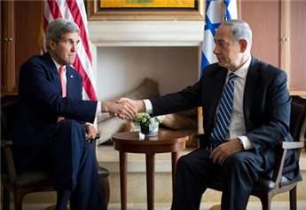 Israeli Prime Minister Benjamin Netanyahu shakes hands with US Secretary of State John Kerry during a meeting on November 6, 2013 in Jerusalem.