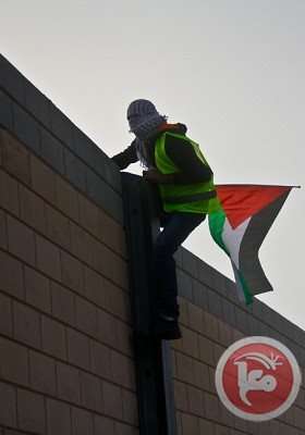 Activists smash, cut holes in Israel separation wall