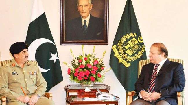 Pakistani Prime Minister Nawaz Sharif (right) meets with General Raheel Sharif in Islamabad on November 26, 2013.