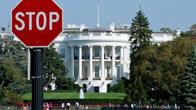 The White House is seen behind a stop sign in Washington, D.C., on Oct. 1, 2013.