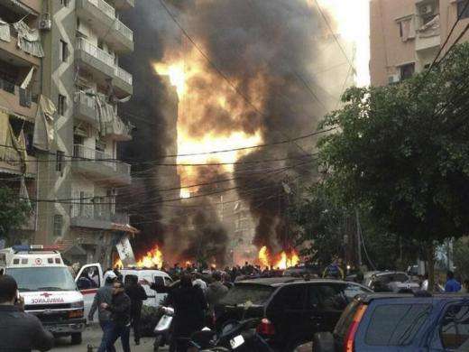 Fire and smoke is seen at the site of an explosion in Beirut southern suburbs January 2 2014.