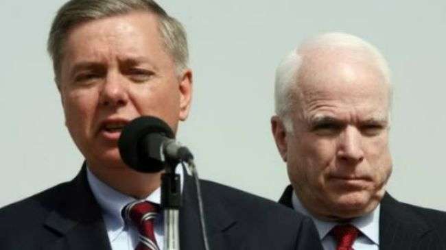 Sens. Lindsey Graham (L) and John McCain