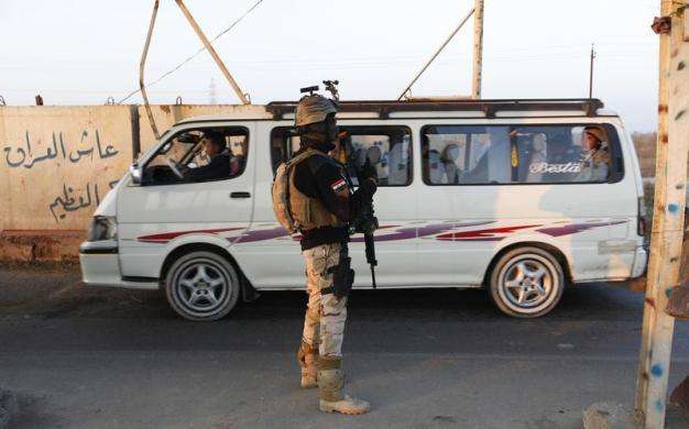 An Iraqi soldier stands guard at a check point in west Baghdad January 6 2014.