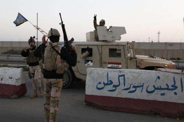 A military convoy drives towards Anbar to reinforce Iraqi troops in the province west of Baghdad January 6 2014.