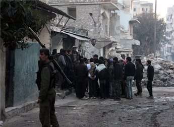 Opposition fighters prepare to storm the headquarters of the Islamic State of Iraq and the Levant (ISIL) fighters in the Bab al-Neirab neighbourhood of the northern Syrian city of Aleppo on Jan. 7, 2014