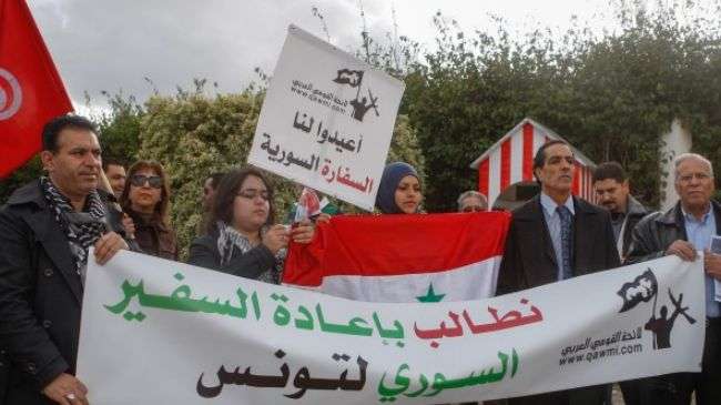 Tunisian protesters call for resumption of ties with Syria.