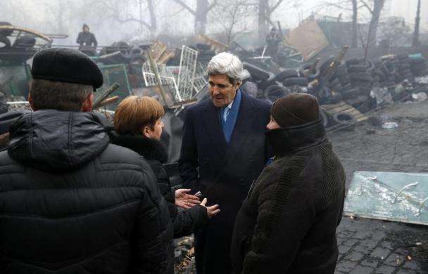 Secretary of State John Kerry stands beside a barricade at the Shrine of the Fallen in Kiev March 4 2014.