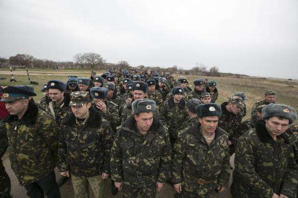 Ukrainian servicemen wait at Belbek airport in the Crimea region March 4 2014.