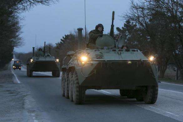 Russian military armored personnel carriers drive on the road from Sevastopol to Simferopol March 4 2014.
