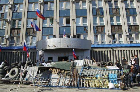 Pro-Russian protesters gather at a barricade outside the offices of the SBU state security service in Luhansk in eastern Ukraine April 7 2014.