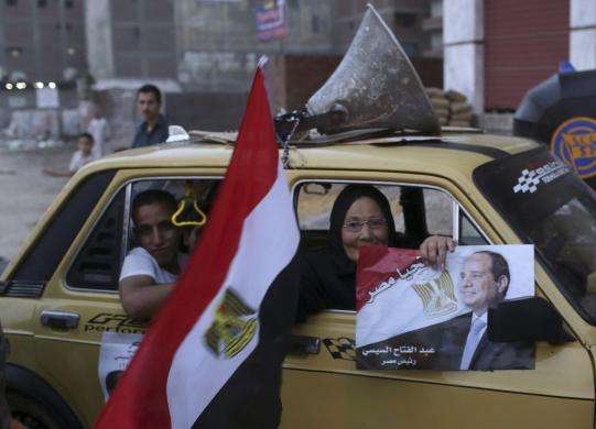 People celebrate on the third day of voting in Egypt election which is expected to make former army chief Abdel Fattah al-Sisi president in Shubra El-Kheima near Cairo May 28 2014.