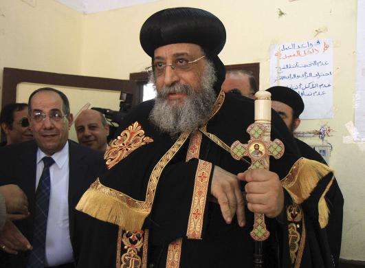 Coptic Pope Tawadros II arrives to cast his ballot on the first day of the presidential elections inside a polling station in Cairo May 26 2014.