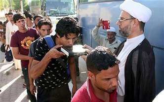 Iraq Shia take up arms to defend the homeland – over 50,000 strong