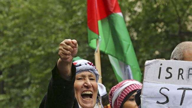 A pro-Palestinian protester shouts anti-Israeli slogans in a massive street march in Paris, Sunday, July 13, 2014.