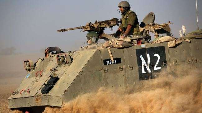 An Israeli armored personnel carrier moves toward the Gaza border, July 20, 2014.