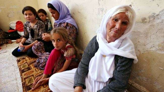 The file photo shows an Iraqi Yazidi family that fled the violence in Sinjar to Dahuk.