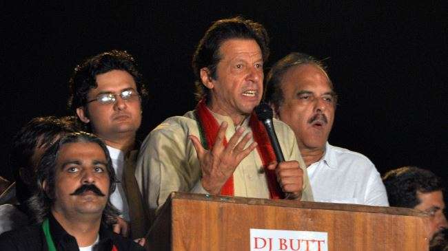 Pakistani opposition politician Imran Khan (C) addresses his supporters during a protest march in the capital Islamabad on August 18, 2014.