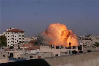 A picture taken on August 26, 2014 shows a ball a fire rising from the house of Palestinian Islamic Jihad leader, Nafez Azzam, that was hit by an Israeli air strike in Rafah