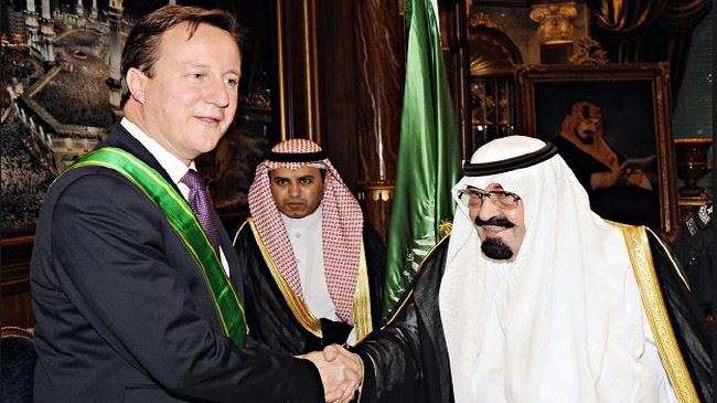 UK Prime Minister David Cameron (L) shakes hands with Saudi King Abdullah Al Saud after receiving the King Abdullah Decoration One in Jeddah.