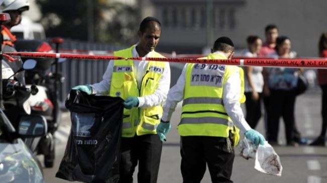 Members of the Israeli emergency response team at the scene of a stabbing in Tel Aviv.