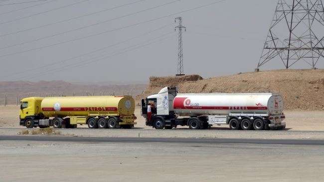 Oil tankers transport petrol sold by the ISIL terrorists to Kurdish businessmen in Iraq