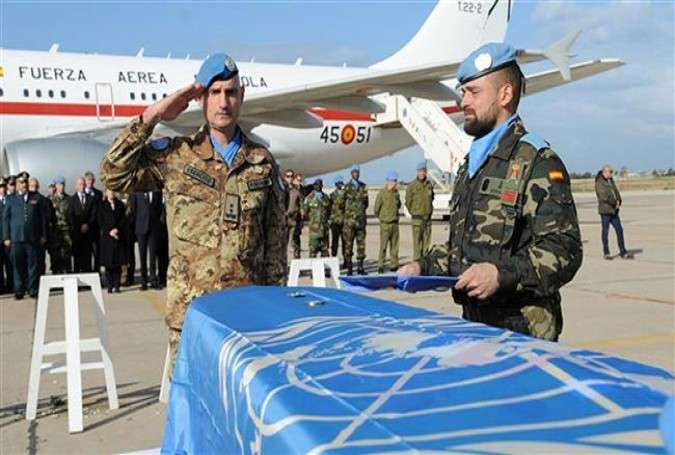 UNIFIL Commander Major-General Luciano Portolano salutes the coffin of Spanish peacekeeper Lance Corporal Francisco Javier Soria Toledo