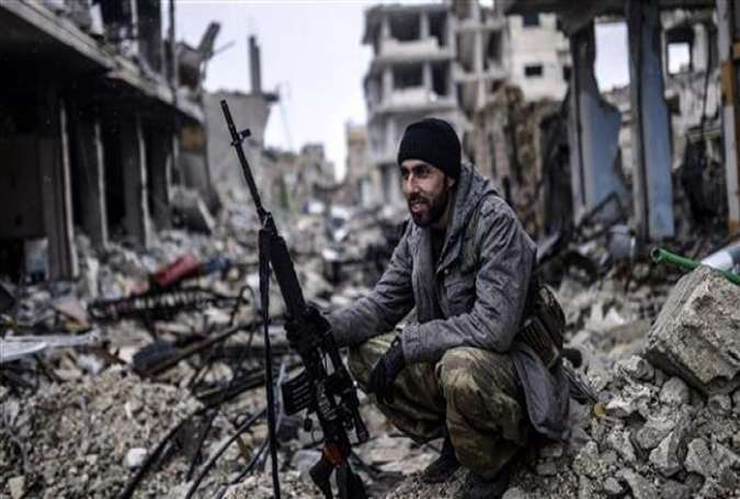 A Kurdish fighter is seen in this January 30, 2015 photo in Kobani, northern Syria