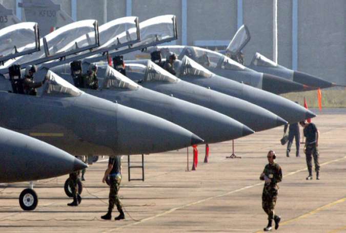 American pilots prepare to board their F-15C fighters.