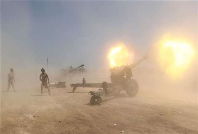 Iraqi forces fire artillery toward ISIL positions in the Karma district, west of the Iraqi capital Baghdad, on April 20, 2015.