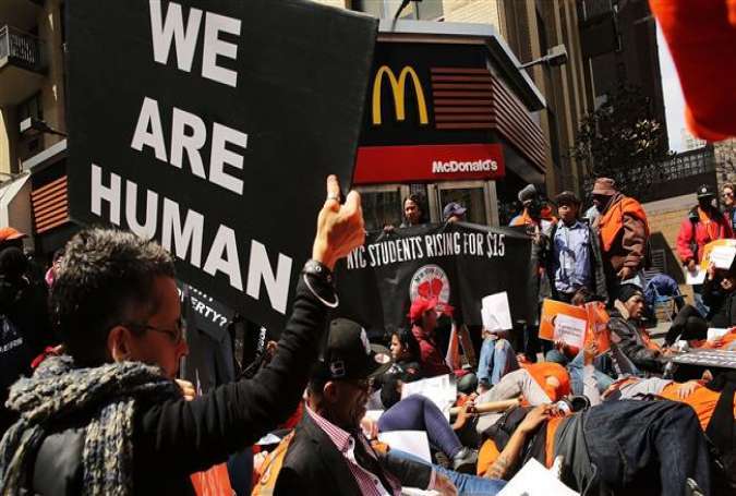 Low wage workers, many in the fast-food industry, join with supporters to demand a minimum wage of $15 an hour in New York City on April 15, 2015.