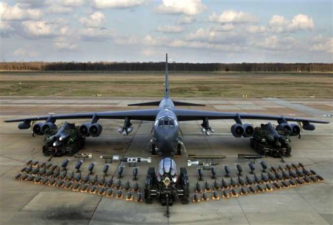A Boeing B-52 strategic bomber display with weapons