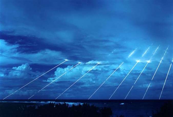 Time exposure shot of testing of the LGM-118A Peacekeeper re-entry vehicles at the Kwajalein Atoll, all eight fired from one missile. The Peacekeeper is a US ballistic missile payload containing several warheads, each capable of being aimed to hit one of a group of targets.