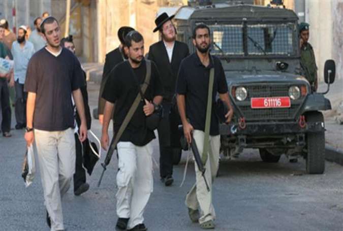 Armed Israeli settlers in the West Bank city of al-Khalil