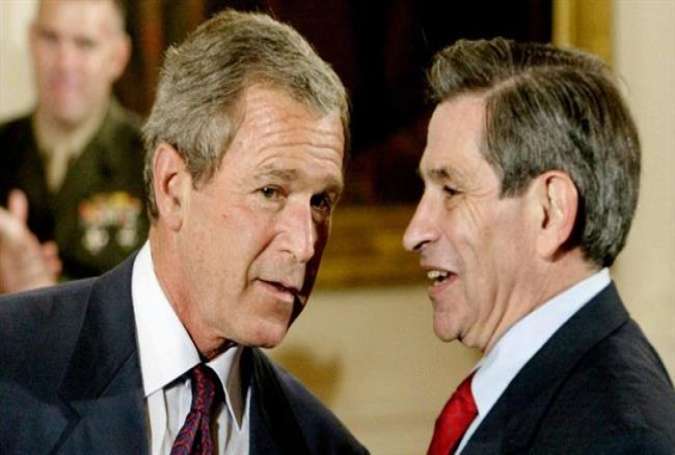 Former US president George W. Bush (L) and his deputy defense secretary Paul Wolfowitz in July 2003