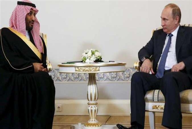 Russian President Vladimir Putin (R) holds talks with Saudi Prince Mohammed bin Salman in St. Petersburg.