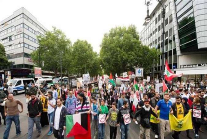 People march during a rally to commemorate the International Quds Day in Berlin, Germany, on July 11, 2015