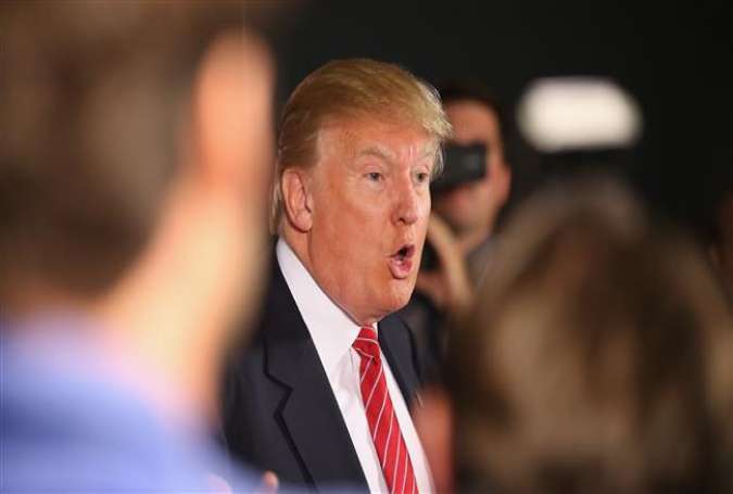 Republican US presidential hopeful businessman Donald Trump talks to reporters on July 18, 2015 in Ames, Iowa.