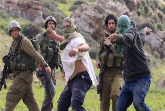 Israeli settlers, backed by army soldiers, throw stones at Palestinians.