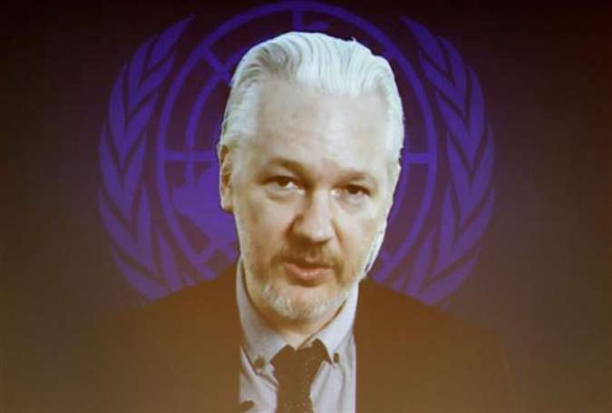 WikiLeaks founder Julian Assange seen on a screen speaking via web cast from the Ecuadorian Embassy in London during an event on the sideline of the United Nations Human Rights Council session in Geneva.