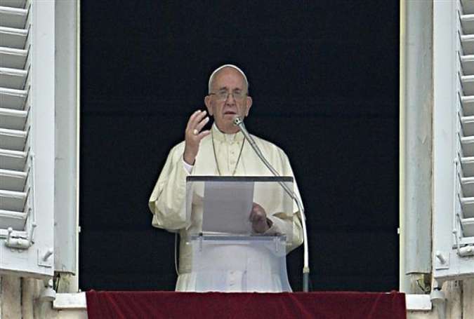 Pope Francis delivers a speech to faithfuls from the window of his apartment.