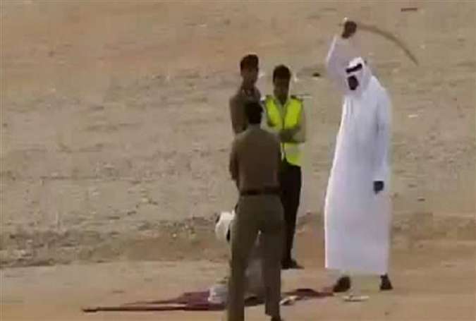 An image grab from an undated video posted to LiveLeak.com shows a Saudi executioner raising his sword before beheading a convict.