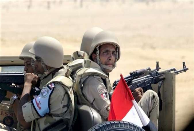 Egyptian army soldiers patrol the Cairo-Ismailia desert road in Egypt, August 6, 2015.